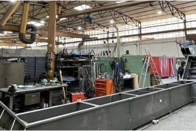 Chain conveyor for transport and cooling of ashes from biomass boilers Implementation of a submerged drag conveyor (redler) for effective cooling and transport.